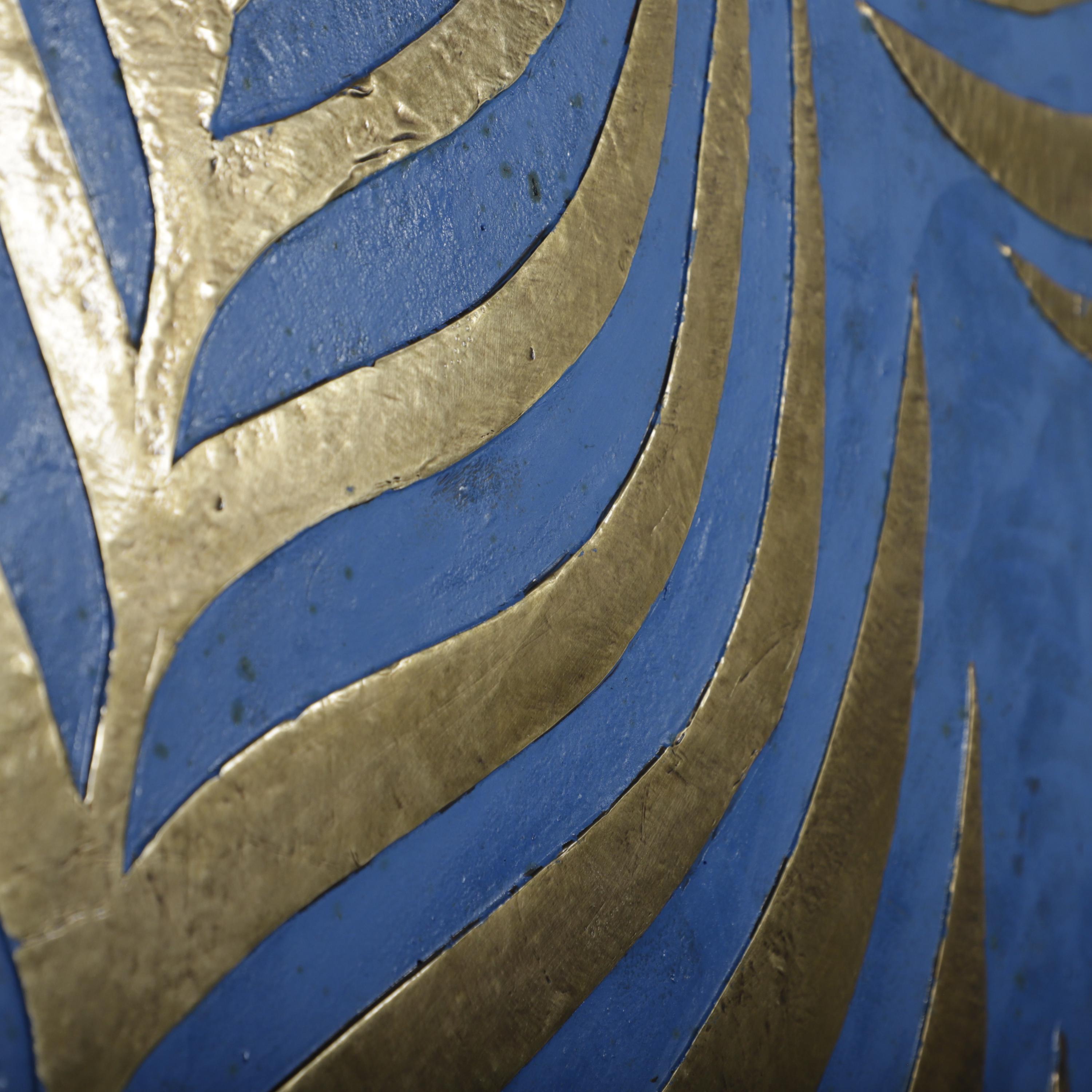 a close-up view of a blue and gold patterned surface, with the blue and gold stripes and lines creating a visually striking and intricate design.