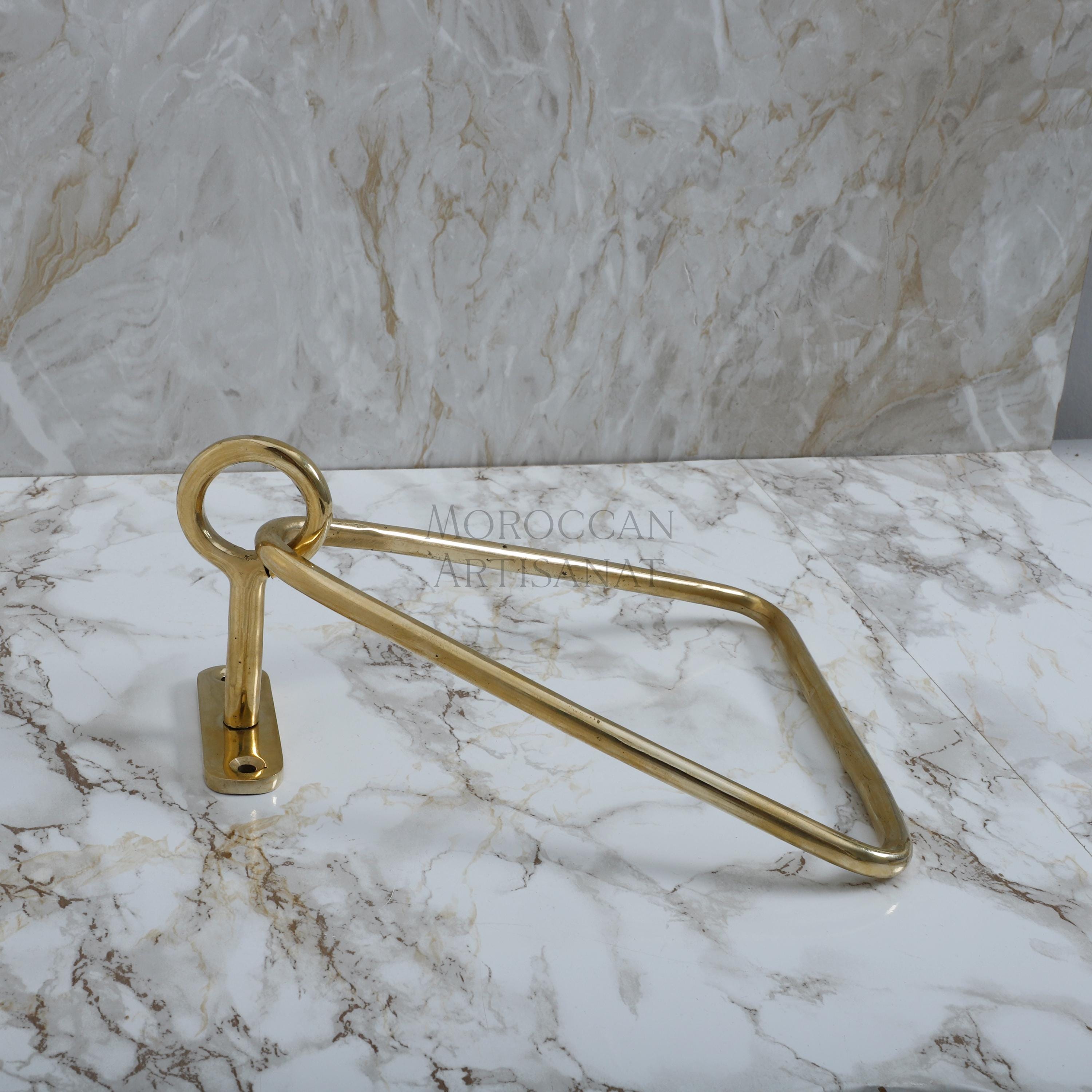 a pair of brass scissors on a marble counter