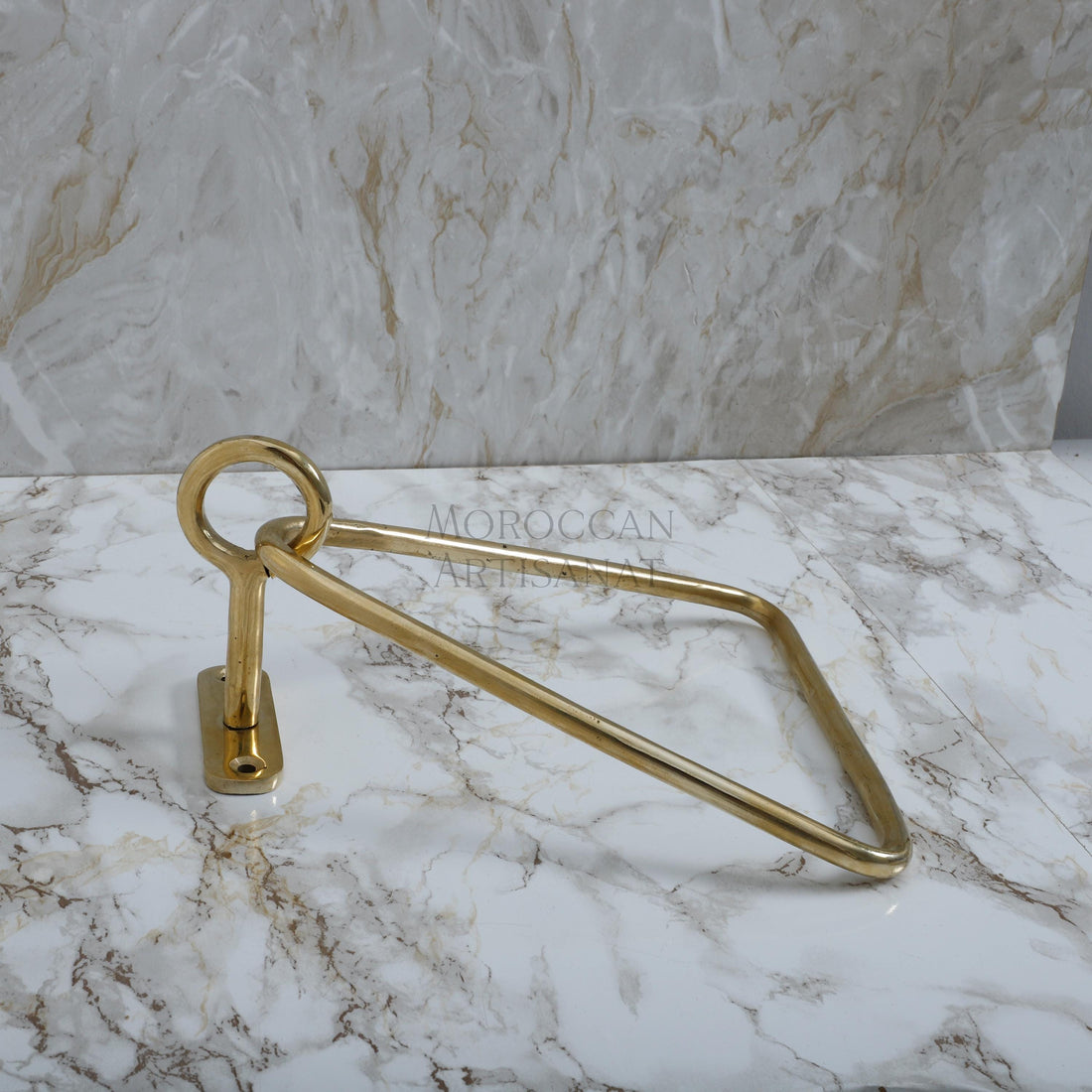 a pair of brass scissors on a marble counter