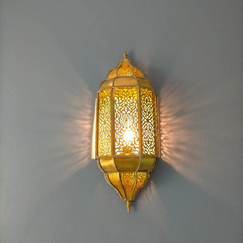 Handmade Moroccan wall sconce with intricate patterns for warm and elegant home lighting decor