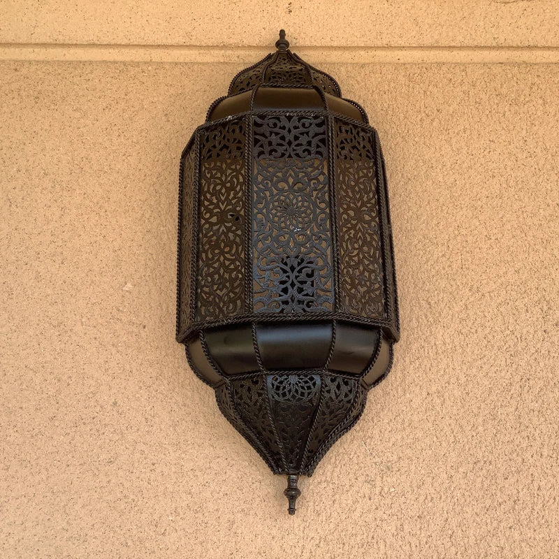 Handmade Moroccan wall sconce with intricate patterns for warm and elegant home lighting decor