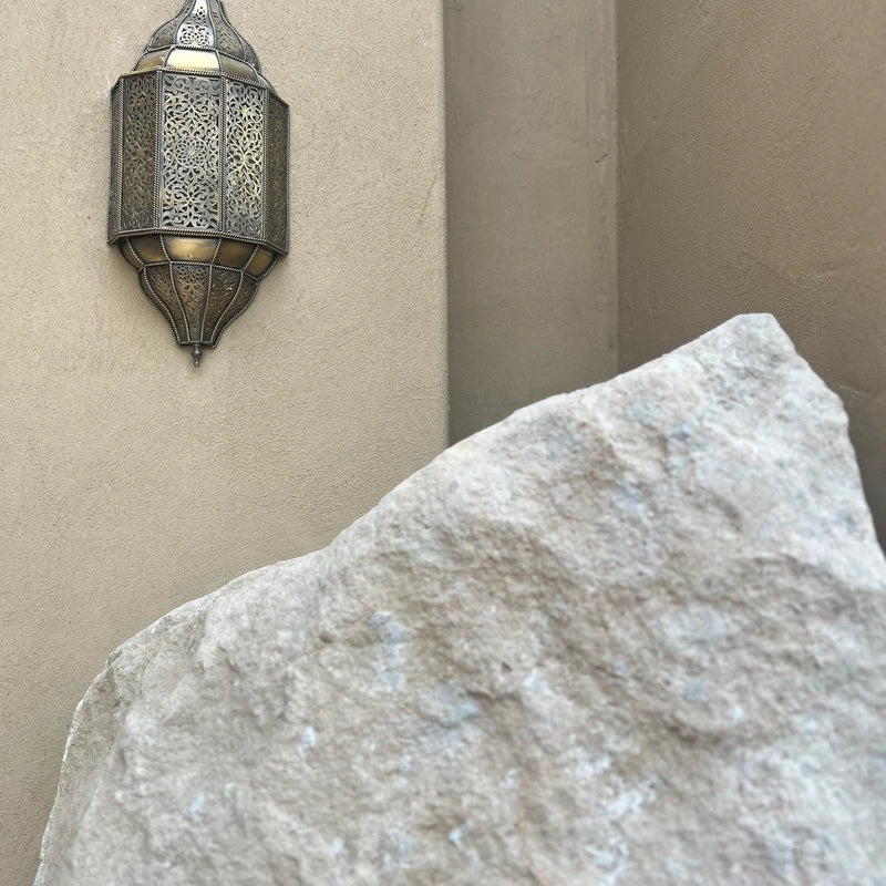 Handmade Moroccan wall sconce with intricate patterns for warm and elegant home lighting decor