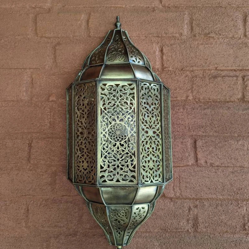 Handmade Moroccan wall sconce with intricate patterns for warm and elegant home lighting decor