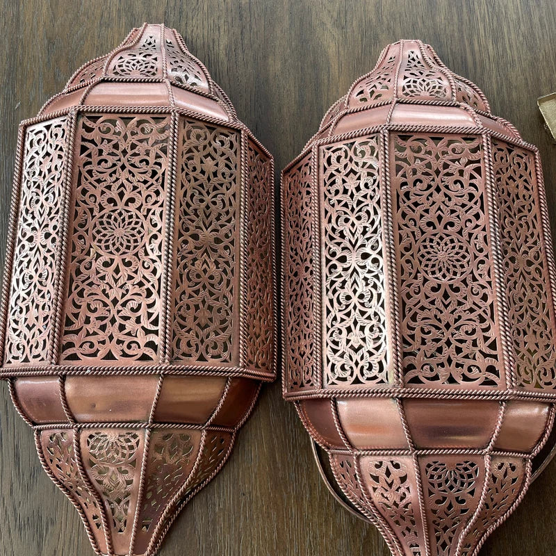 Handmade Moroccan wall sconce with intricate patterns for warm and elegant home lighting decor