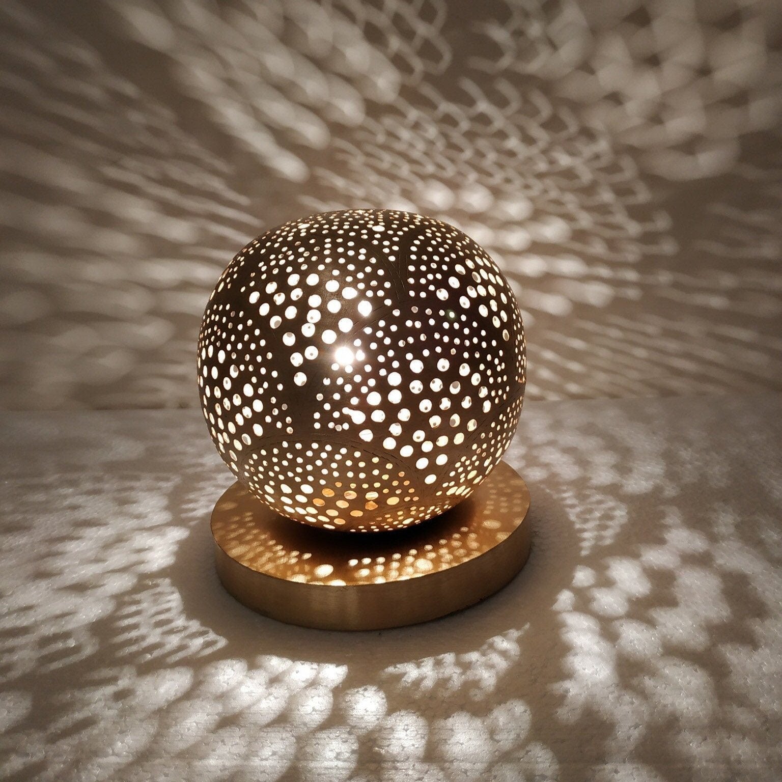 Handcrafted Moroccan modern brass table lamp with bold perforated design

