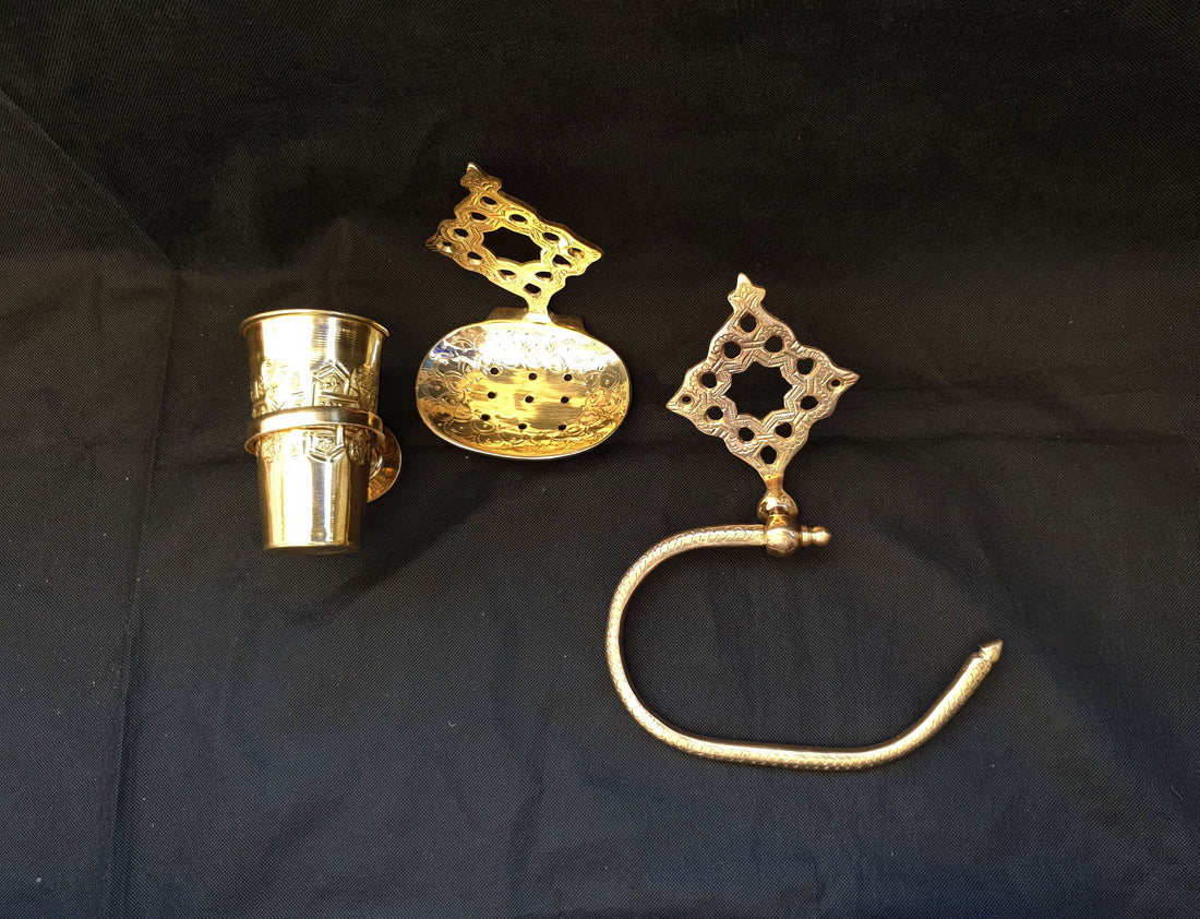 Elegant brass toilet accessories set with coordinated pieces for a stylish bathroom look