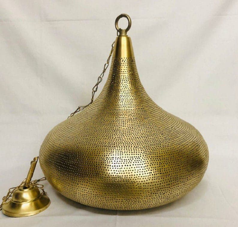 Elegant Moroccan brass pendant light with intricate patterns and warm glow for stylish home decor