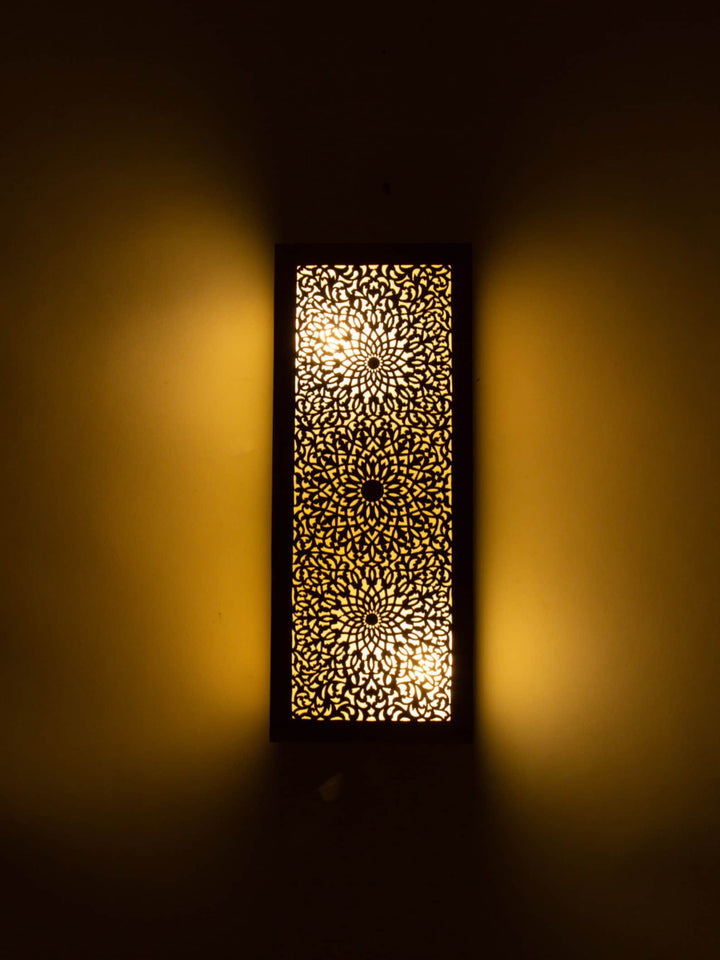 Elegant Moroccan wall light sconce with intricate patterns for warm and artistic home decor