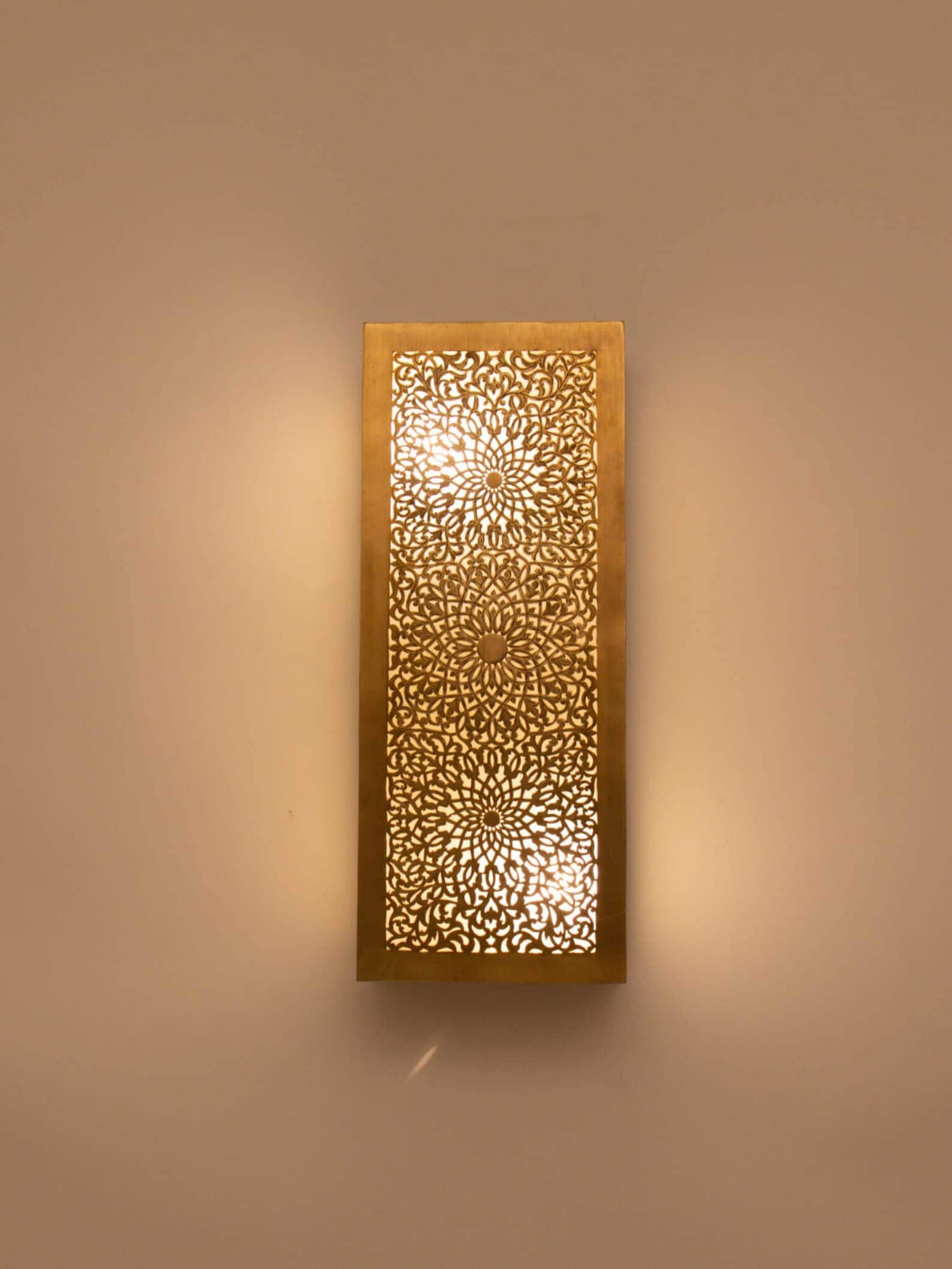Elegant Moroccan wall light sconce with intricate patterns for warm and artistic home decor