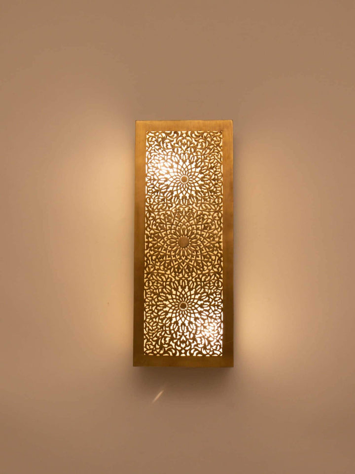 Elegant Moroccan wall light sconce with intricate patterns for warm and artistic home decor