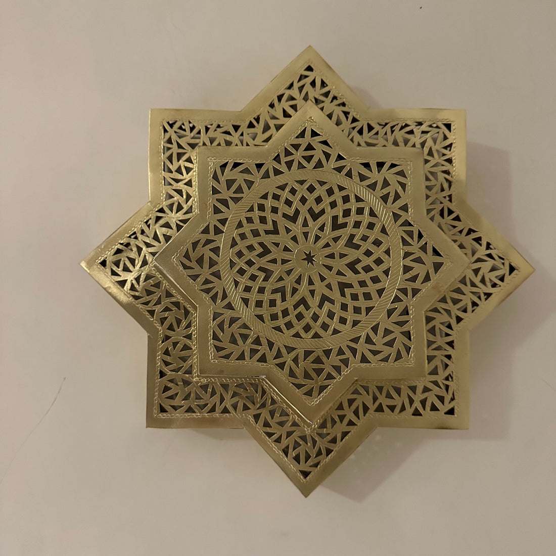 Handcrafted Moroccan brass sconce lighting with intricate patterns for warm and elegant decor