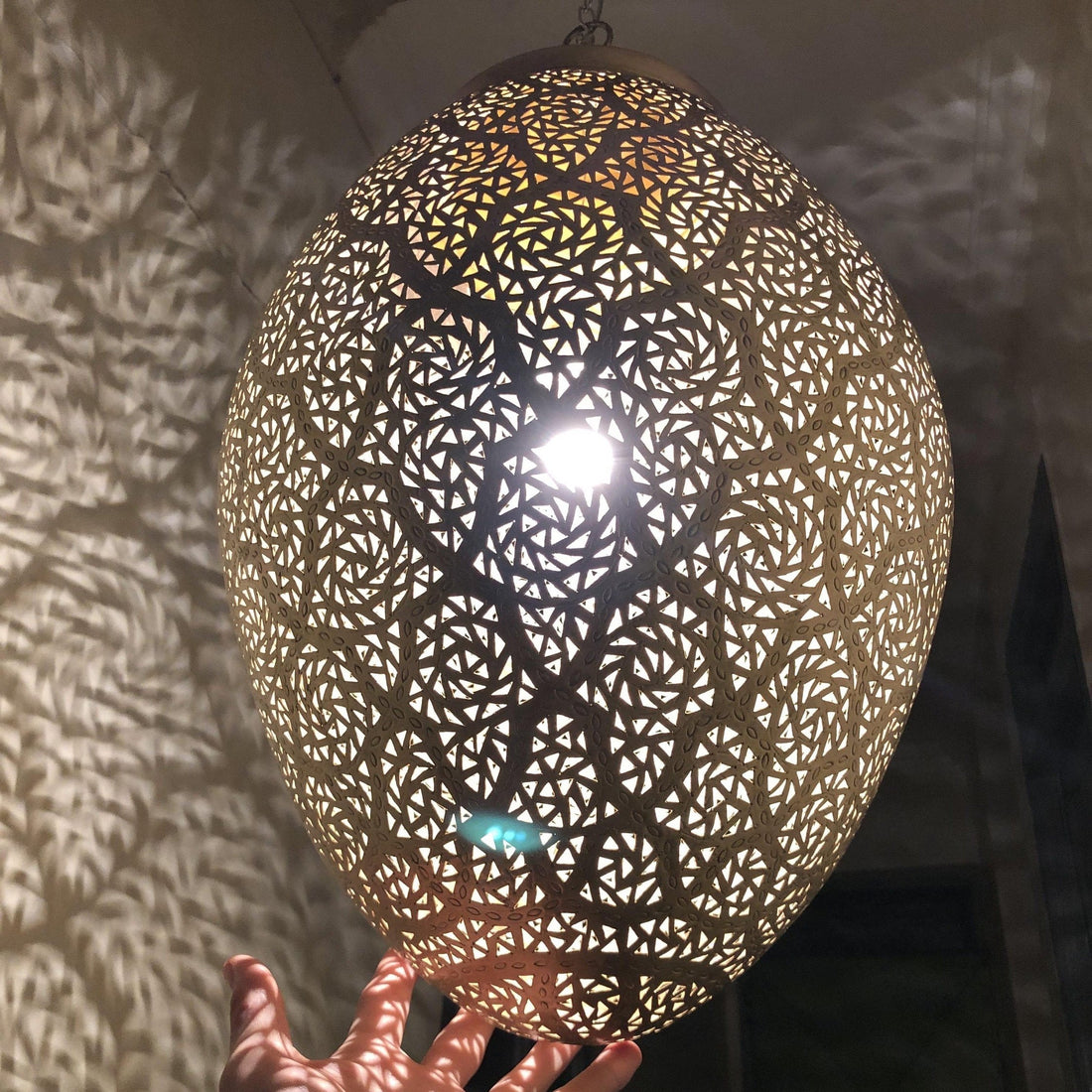 Moroccan pendant lamp brass fixture with intricate patterns for warm and elegant home decor