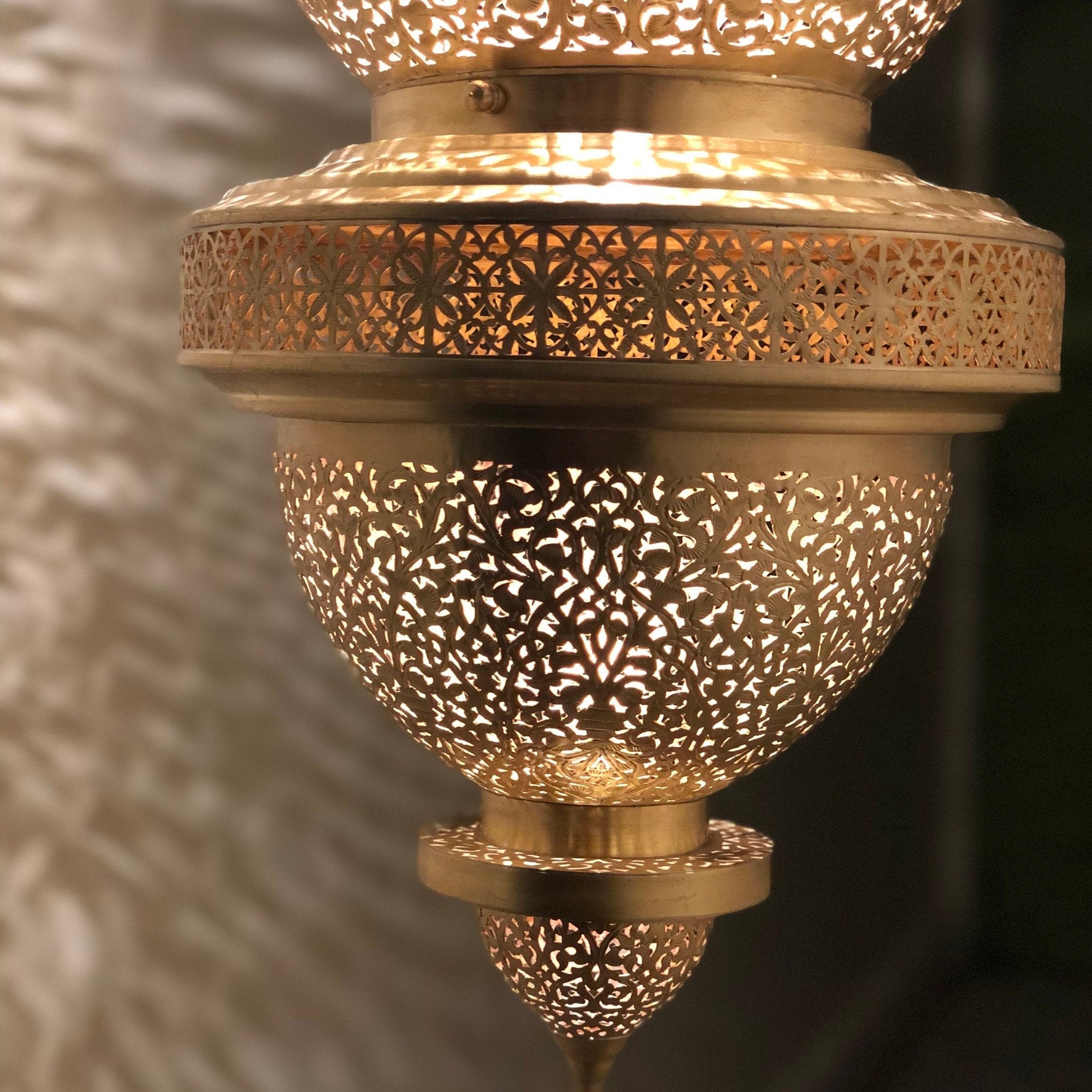 Moroccan pendant light in brass with intricate patterns for a warm and elegant home decor