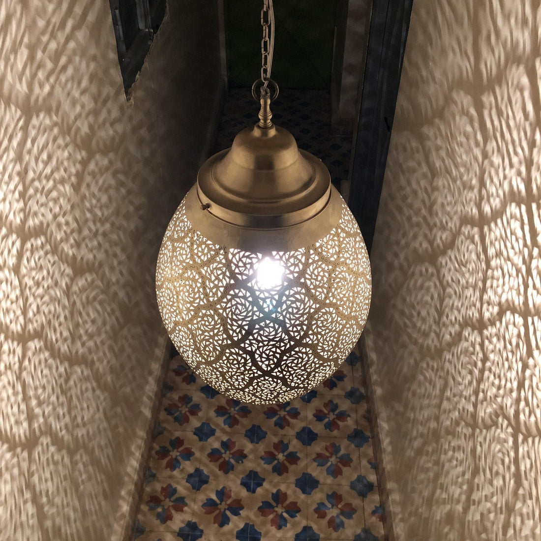 Moroccan pendant lamp brass fixture with intricate patterns for warm and elegant home decor