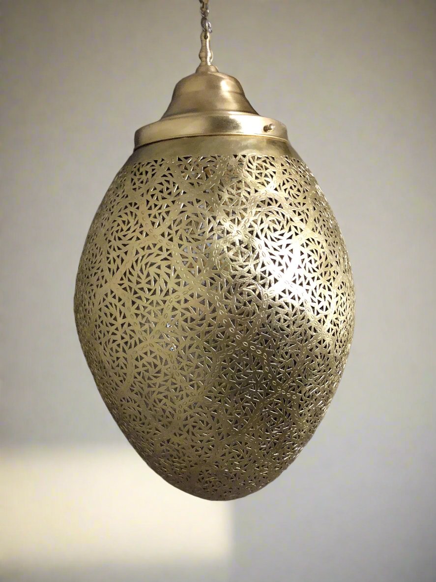 Moroccan pendant lamp brass fixture with intricate patterns for warm and elegant home decor