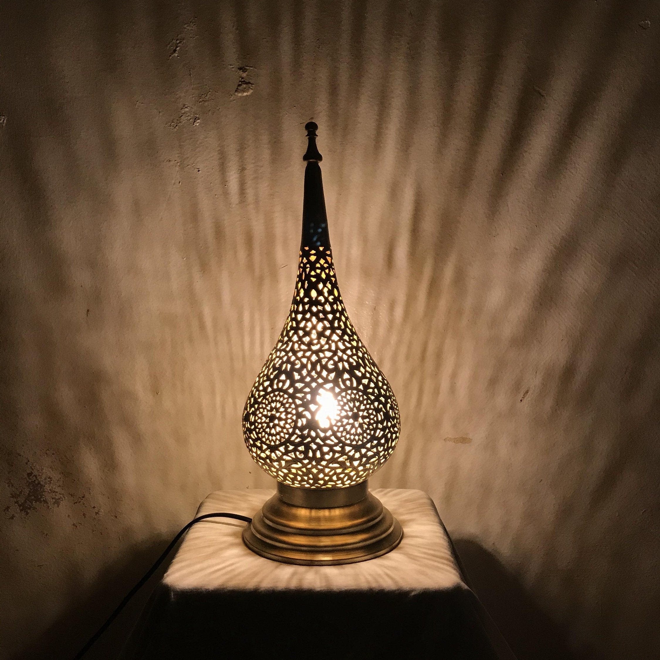Handcrafted Moroccan table lamp with intricate teardrop cutout design


