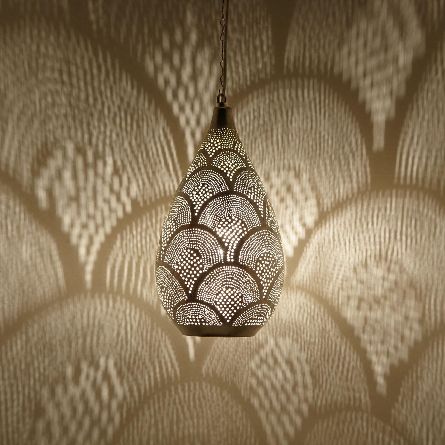Handcrafted Moroccan pendant light with intricate patterns for warm and inviting home decor