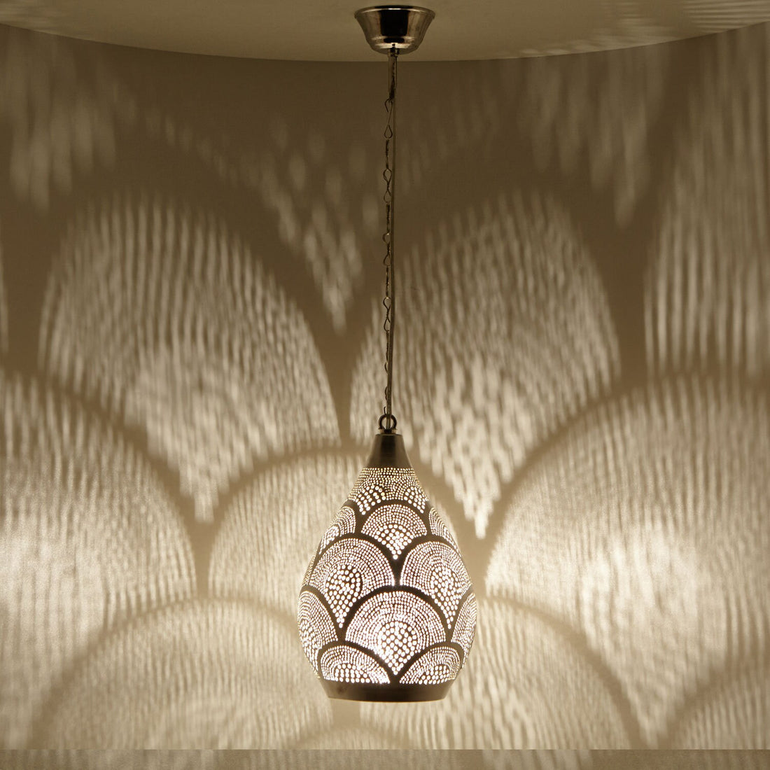 Handcrafted Moroccan pendant light with intricate patterns for warm and inviting home decor