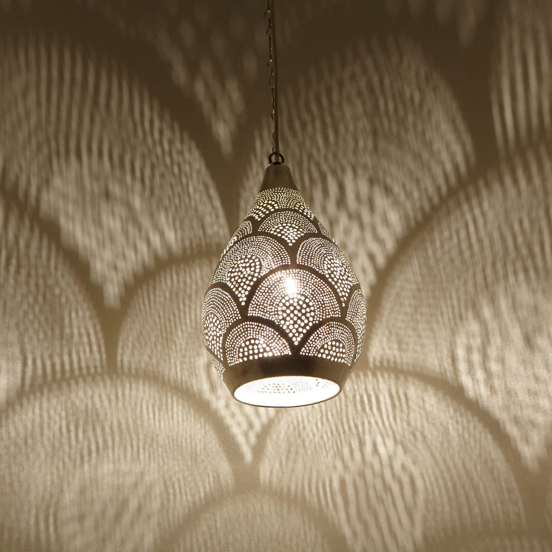 Handcrafted Moroccan pendant light with intricate patterns for warm and inviting home decor