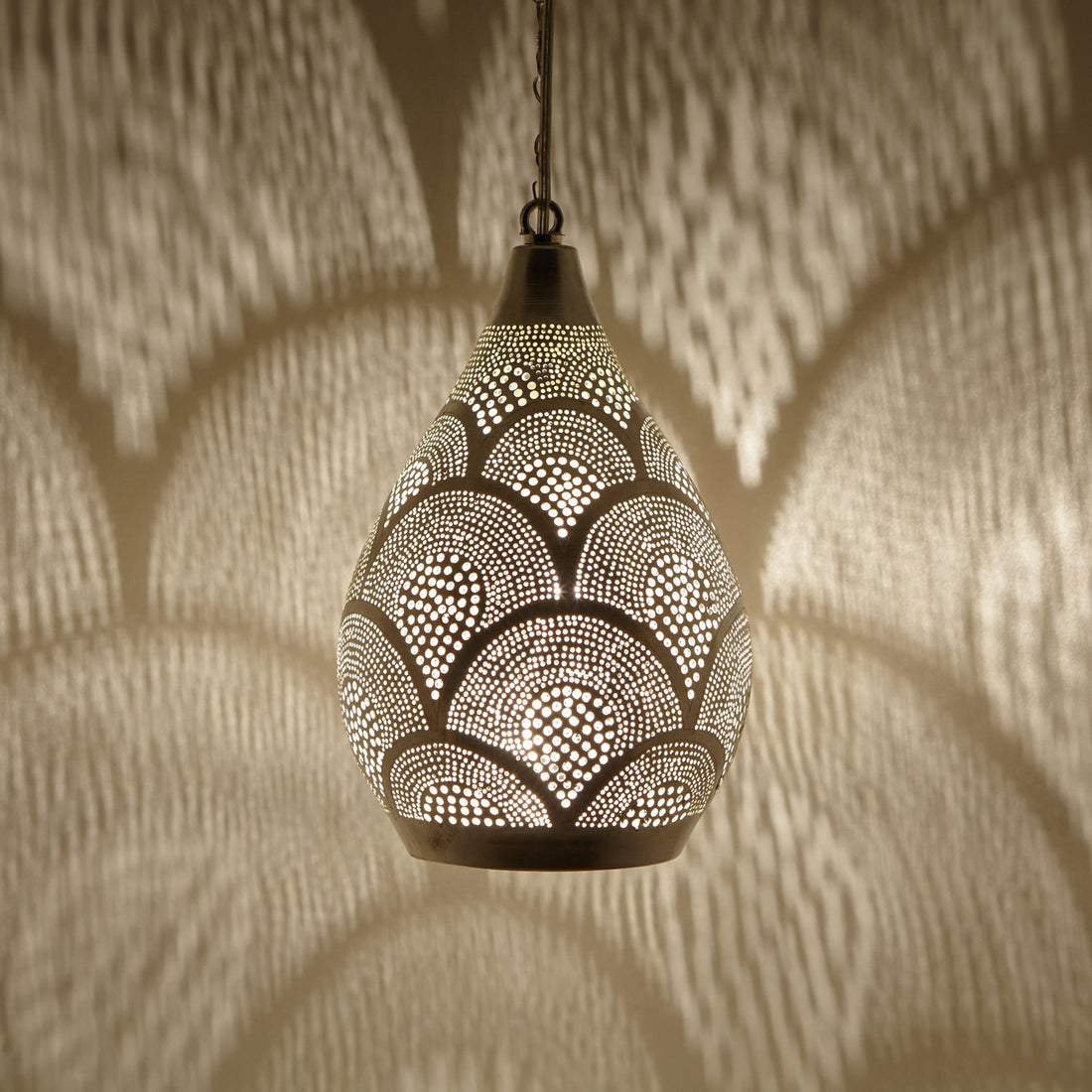 Handcrafted Moroccan pendant light with intricate patterns for warm and inviting home decor