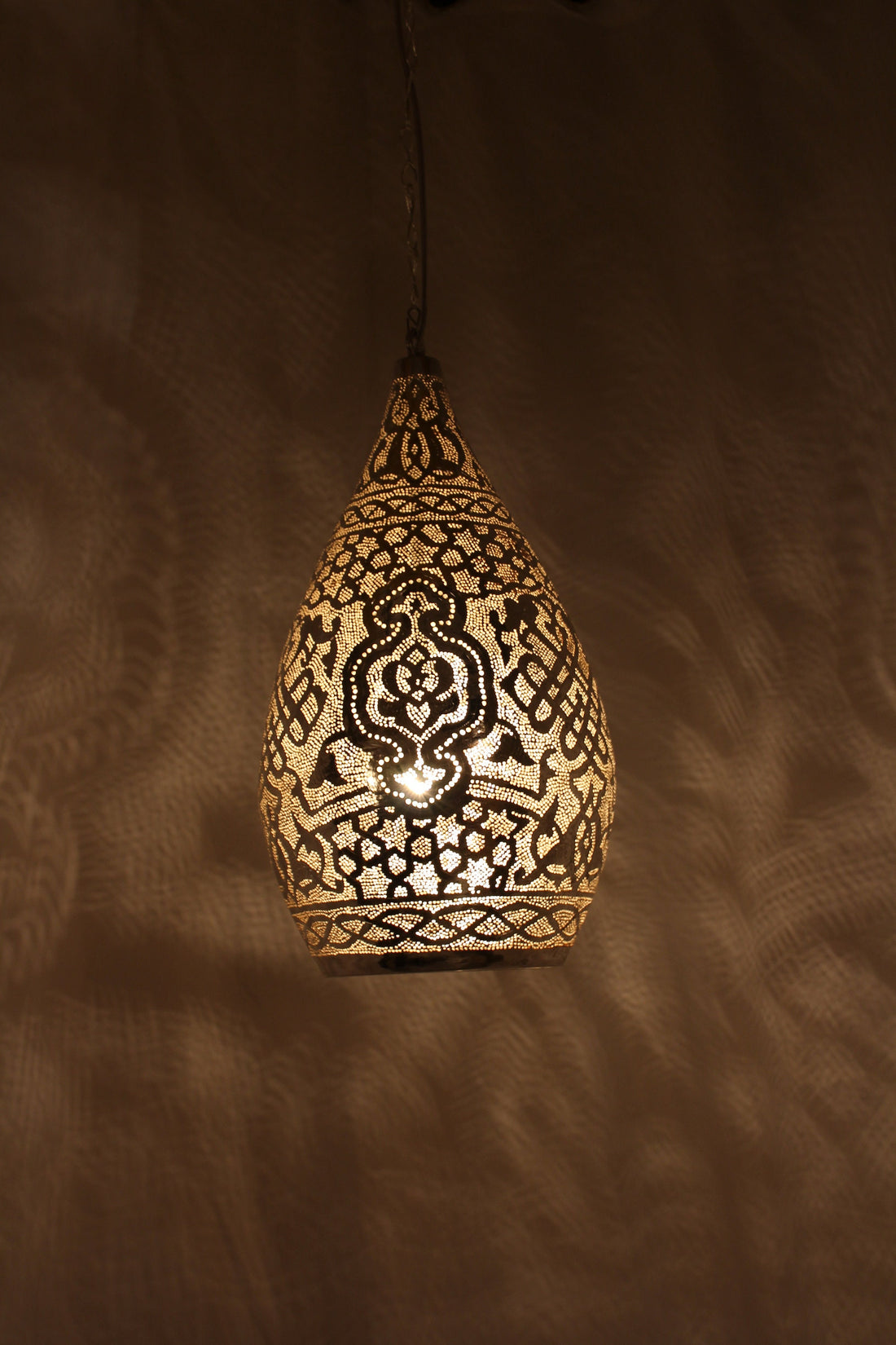 Handcrafted Moroccan brass lamp with intricate design for warm and elegant home lighting