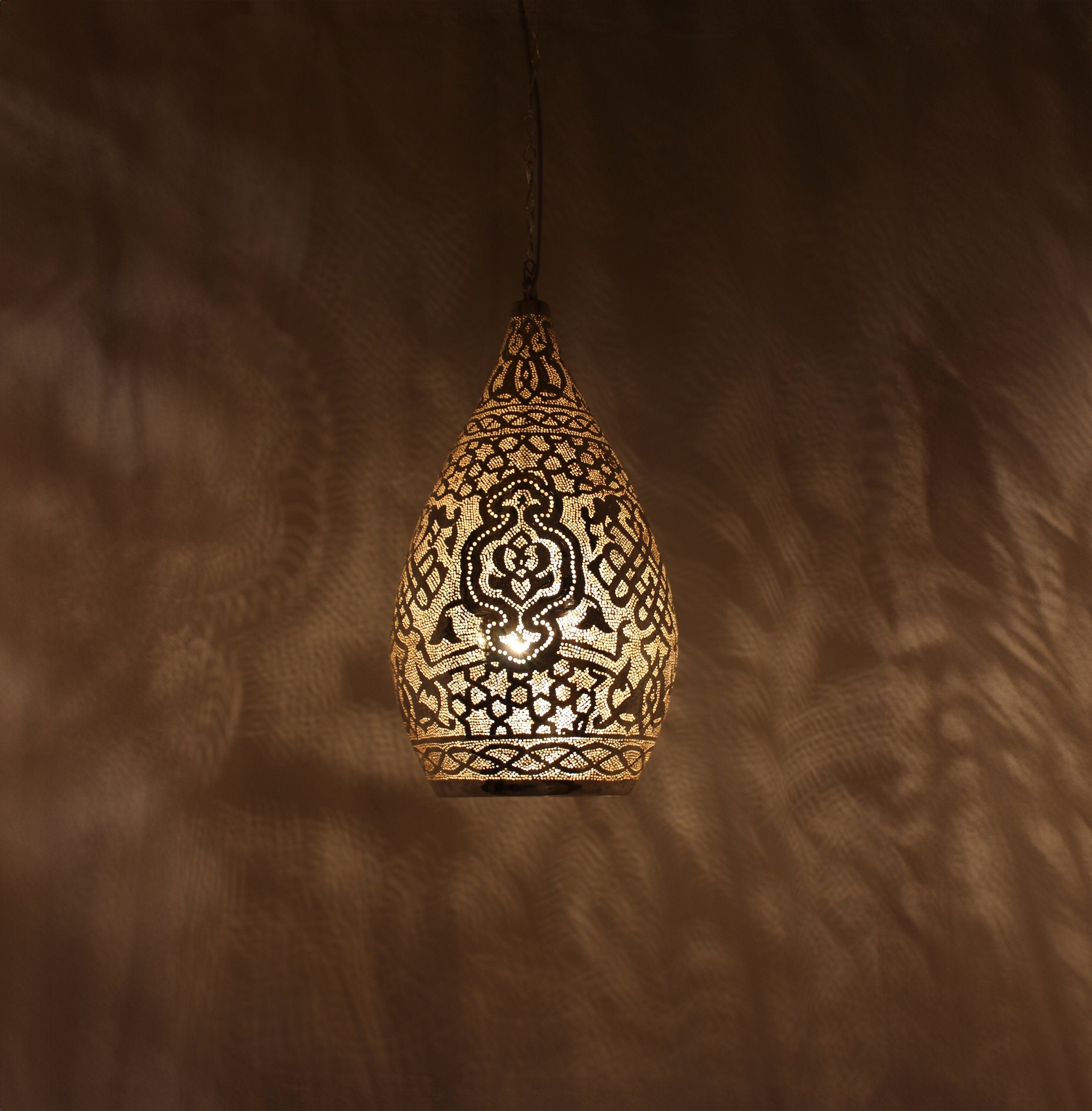 Handcrafted Moroccan brass ceiling lamp with intricate cutout design

