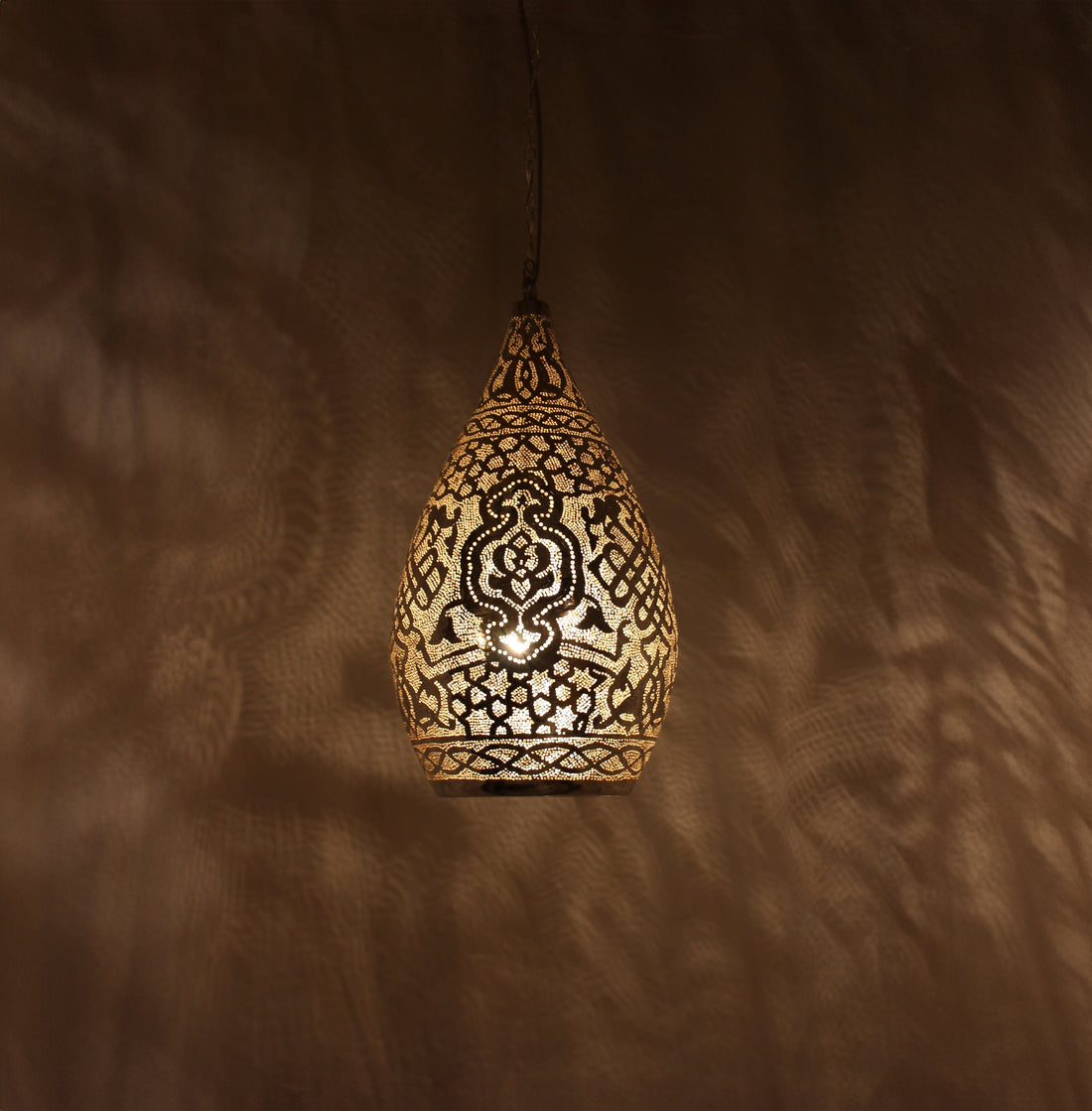 Handcrafted Moroccan brass lamp with intricate design for warm and elegant home lighting