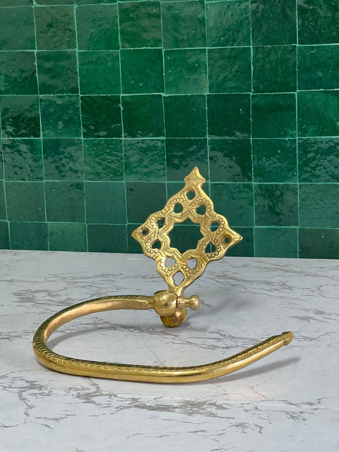 Elegant hand towel holder with a sleek design for bathroom or kitchen use