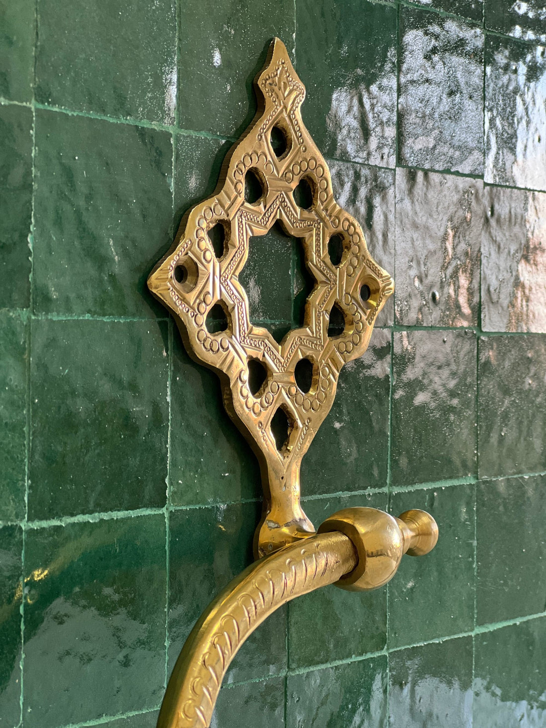 Elegant hand towel holder with a sleek design for bathroom or kitchen use