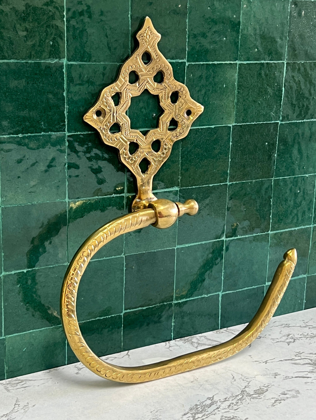 Elegant hand towel holder with a sleek design for bathroom or kitchen use