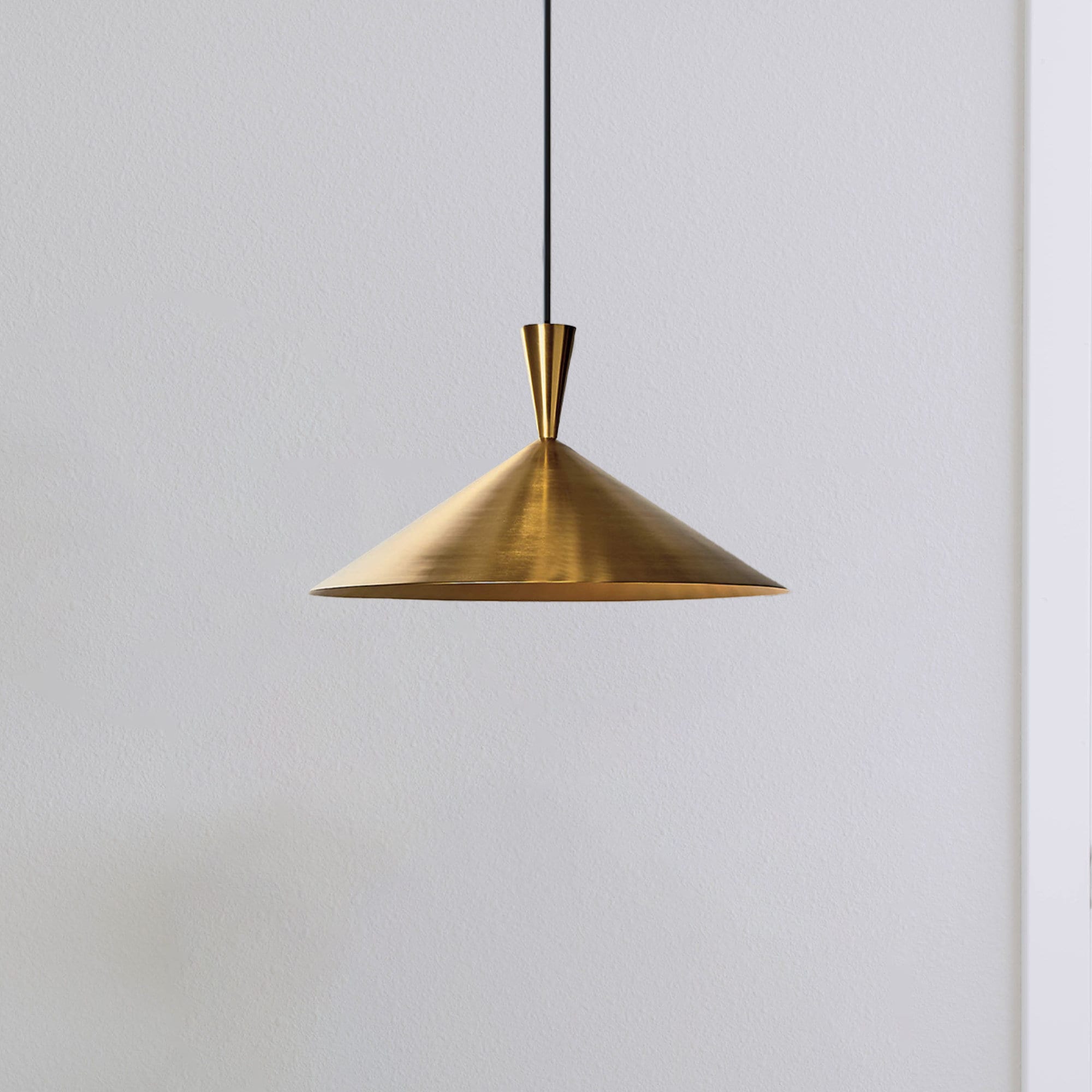 Elegant brass pendant light over a kitchen island with adjustable height