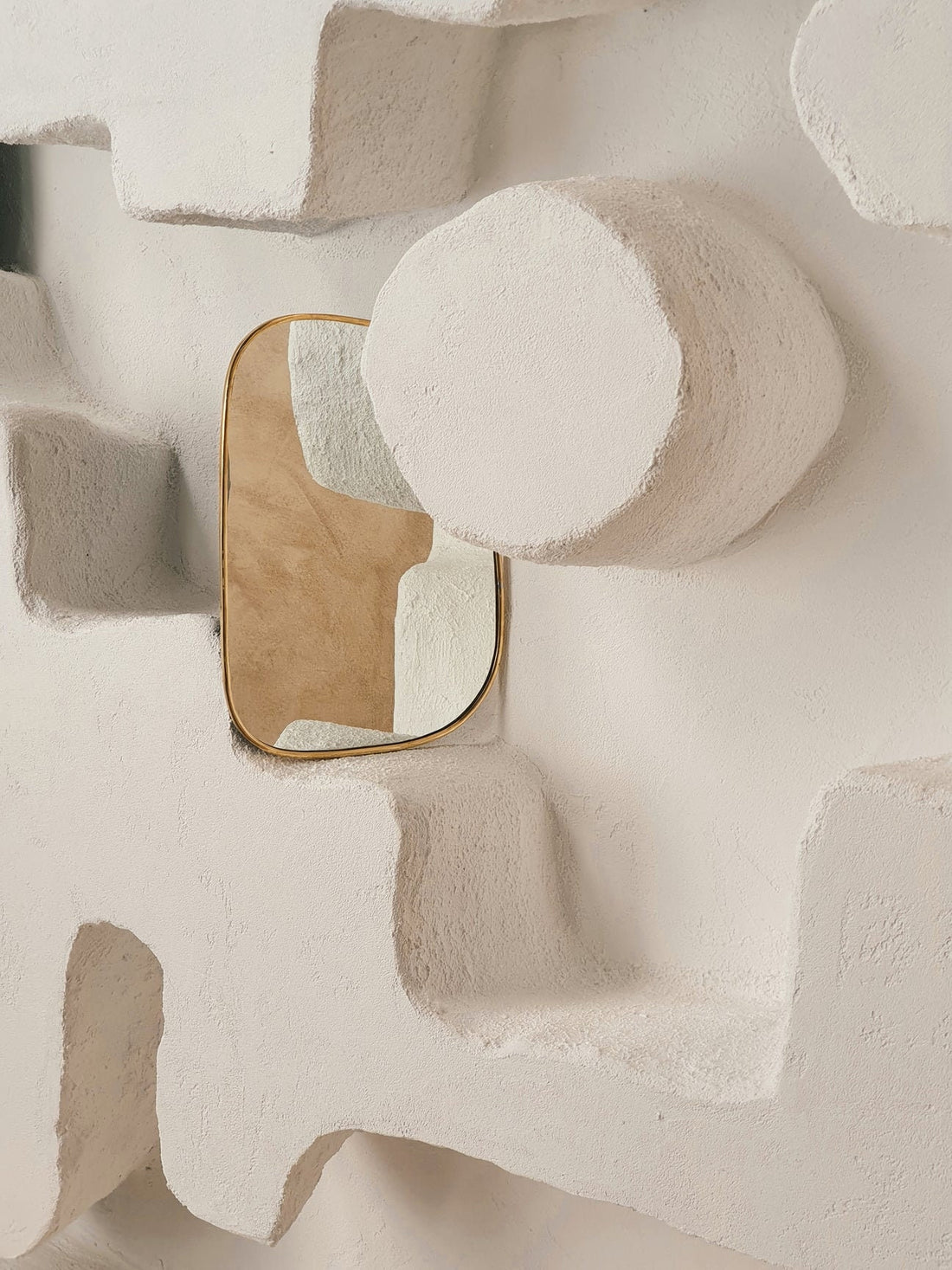 Set of irregularly shaped brass mirrors for modern and artistic home decor