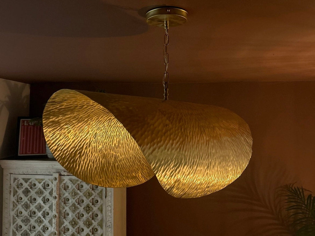 Brass leaf pendant light with intricate design for elegant and nature-inspired decor