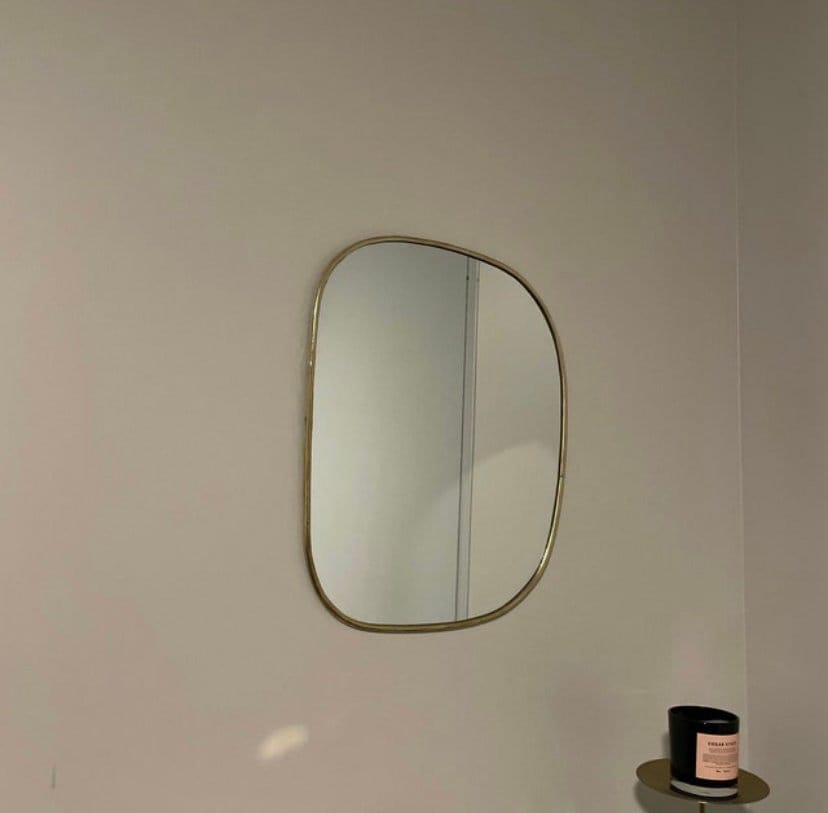 Set of irregularly shaped brass mirrors for modern and artistic home decor