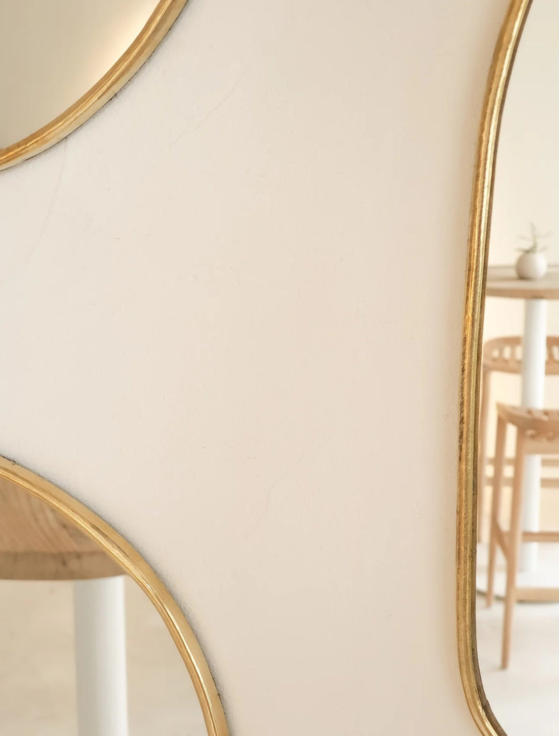 Set of irregularly shaped brass mirrors for modern and artistic home decor