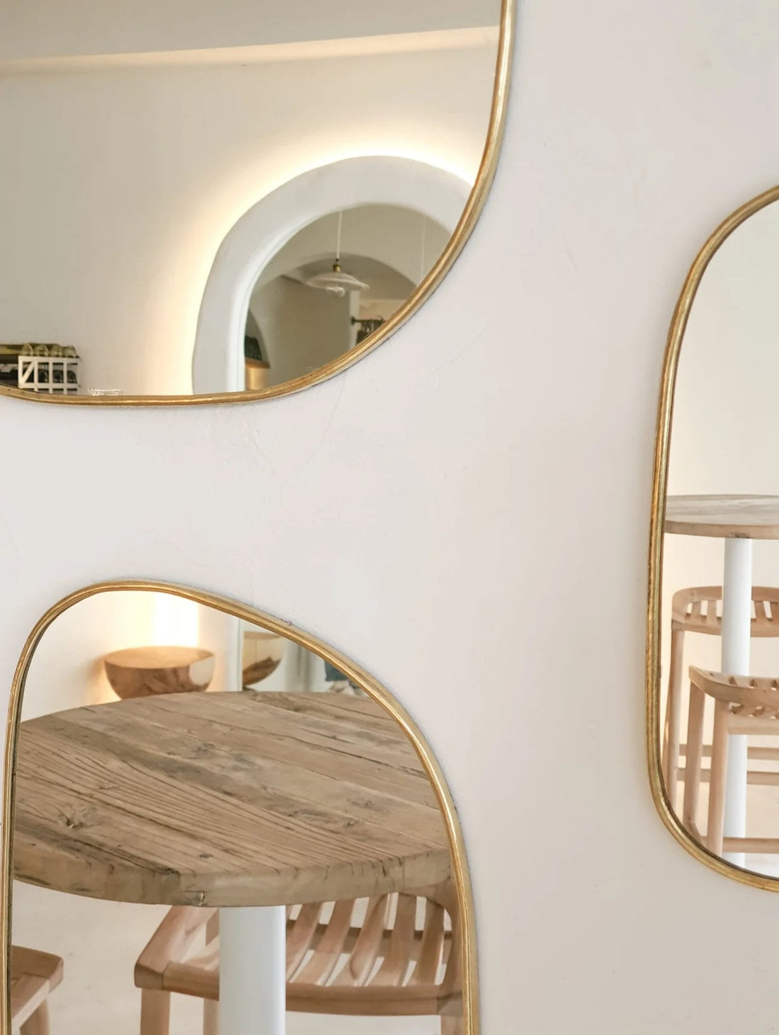 Set of irregularly shaped brass mirrors for modern and artistic home decor