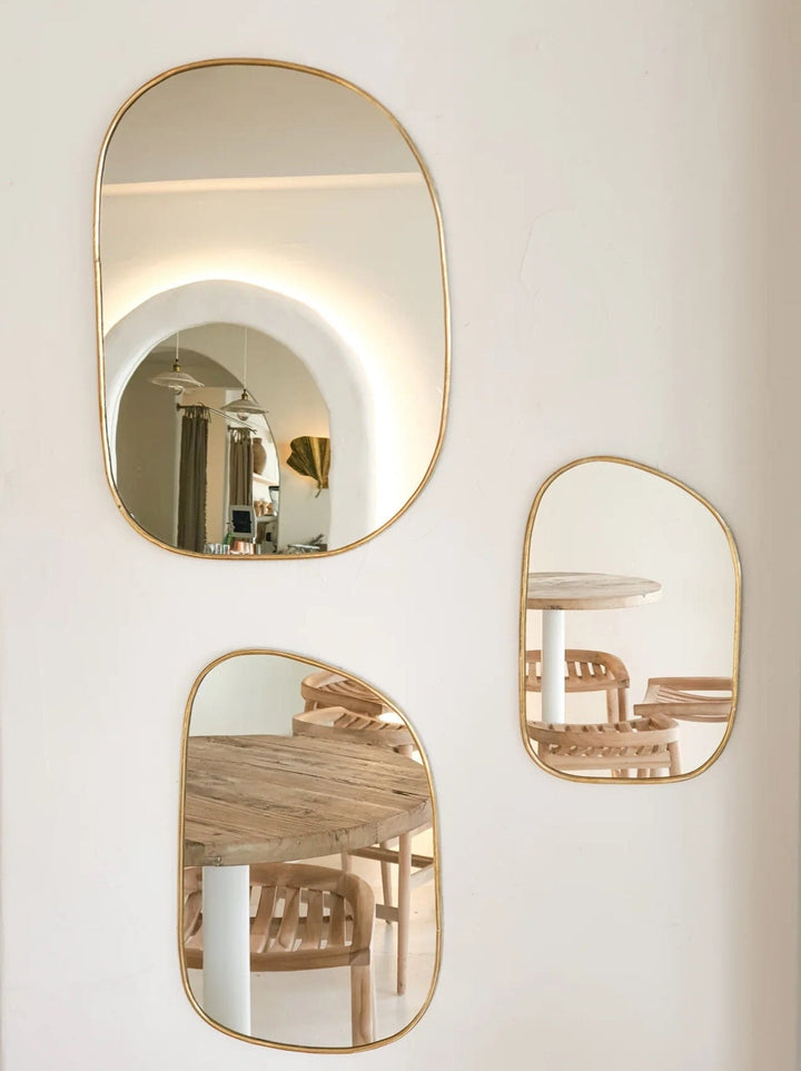 Set of irregularly shaped brass mirrors for modern and artistic home decor