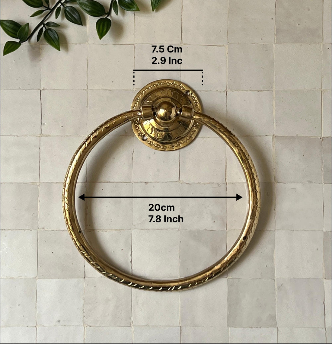 Unlacquered brass towel ring with a minimalist design for elegant bathroom decor