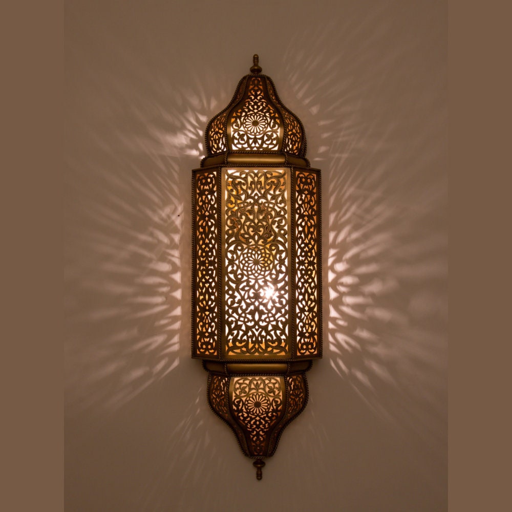 Handcrafted brass Moroccan wall light sconce with intricate patterns for warm and elegant lighting decor