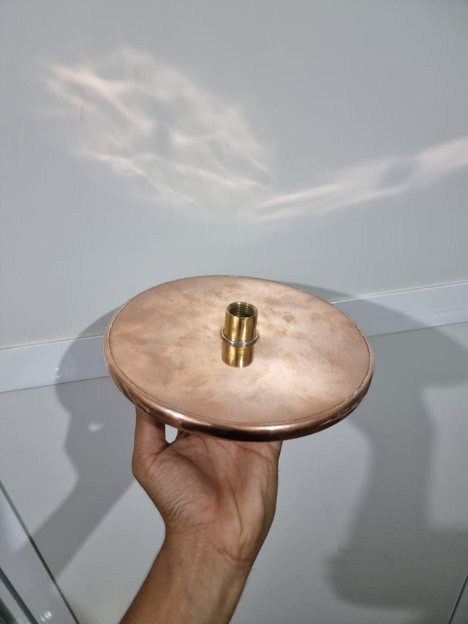 Luxurious copper rainfall shower head with wide spray for a spa-like bathroom upgrade