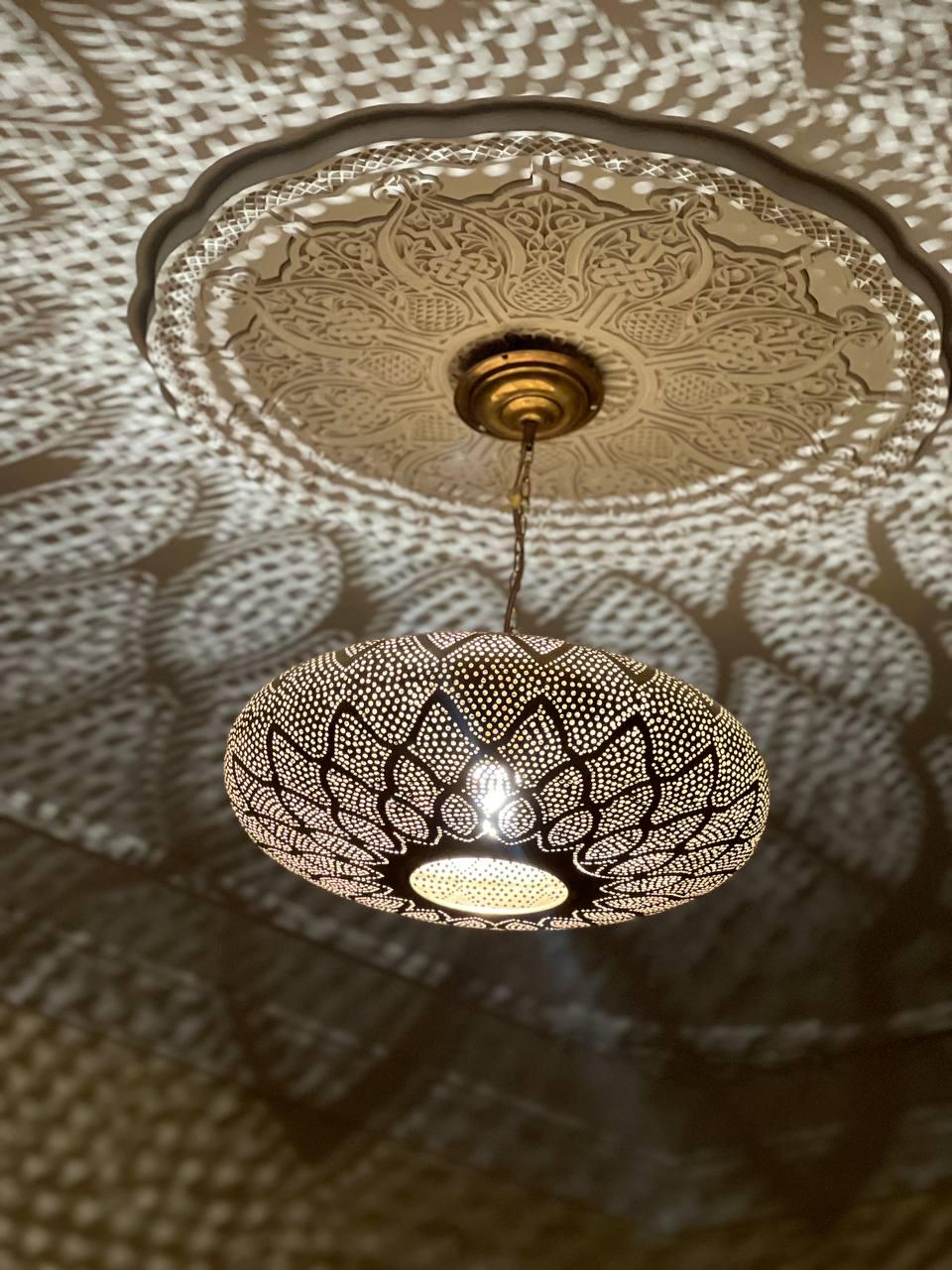 Handcrafted Moroccan pendant light with intricate patterns for warm and elegant home lighting