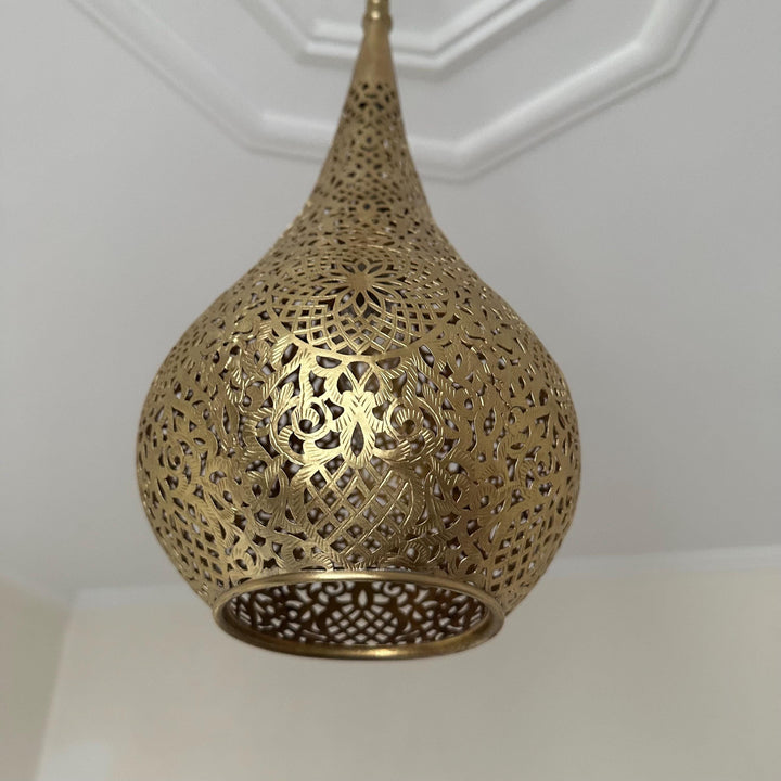 Handcrafted Moroccan brass ceiling light with intricate patterns for warm and elegant home decor