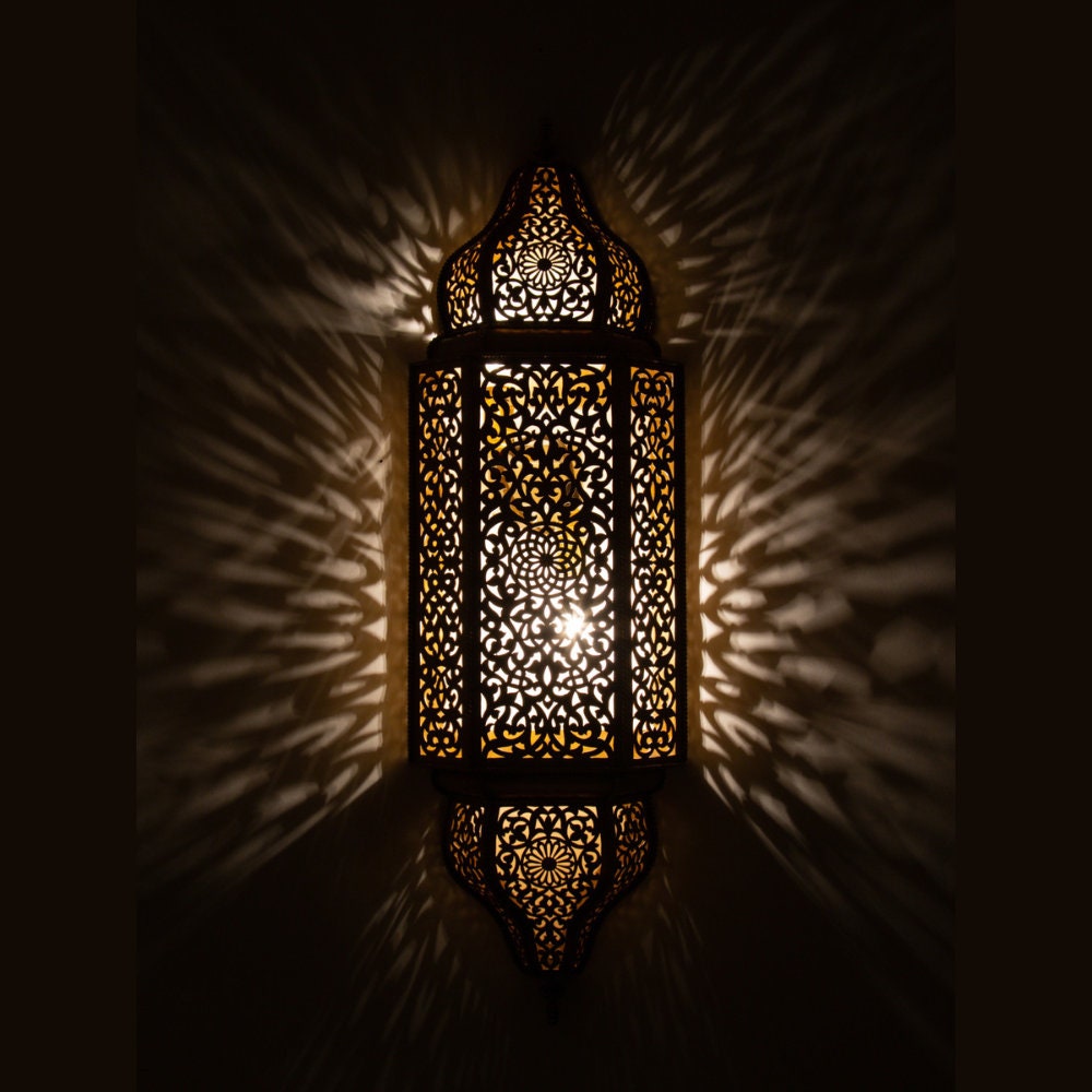 Handcrafted brass Moroccan wall light sconce with intricate patterns for warm and elegant lighting decor