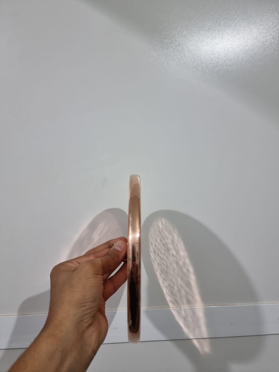 Luxurious copper rainfall shower head with wide spray for a spa-like bathroom upgrade