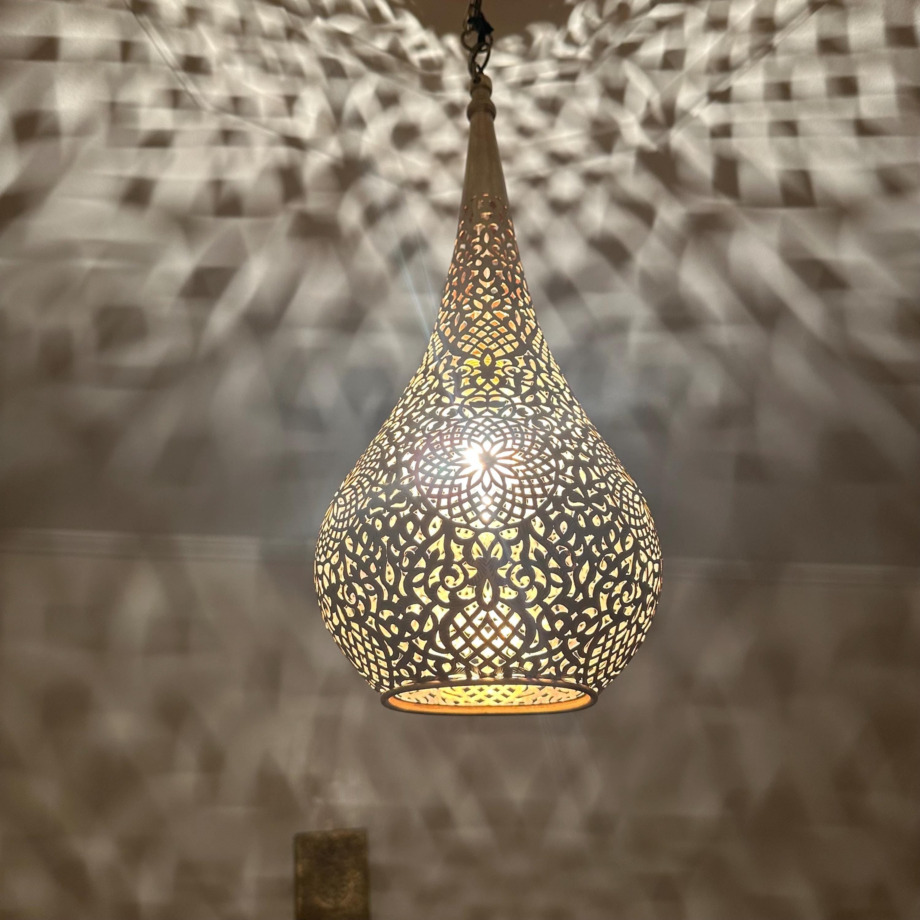 Handcrafted Moroccan brass ceiling light with intricate patterns for warm and elegant home decor