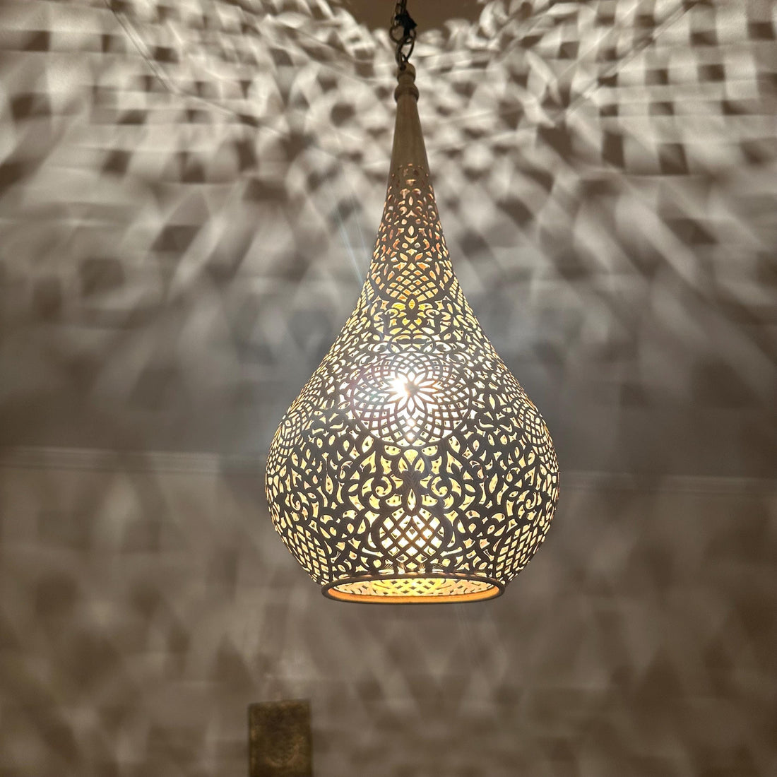 Handcrafted Moroccan brass ceiling light with intricate patterns for warm and elegant home decor