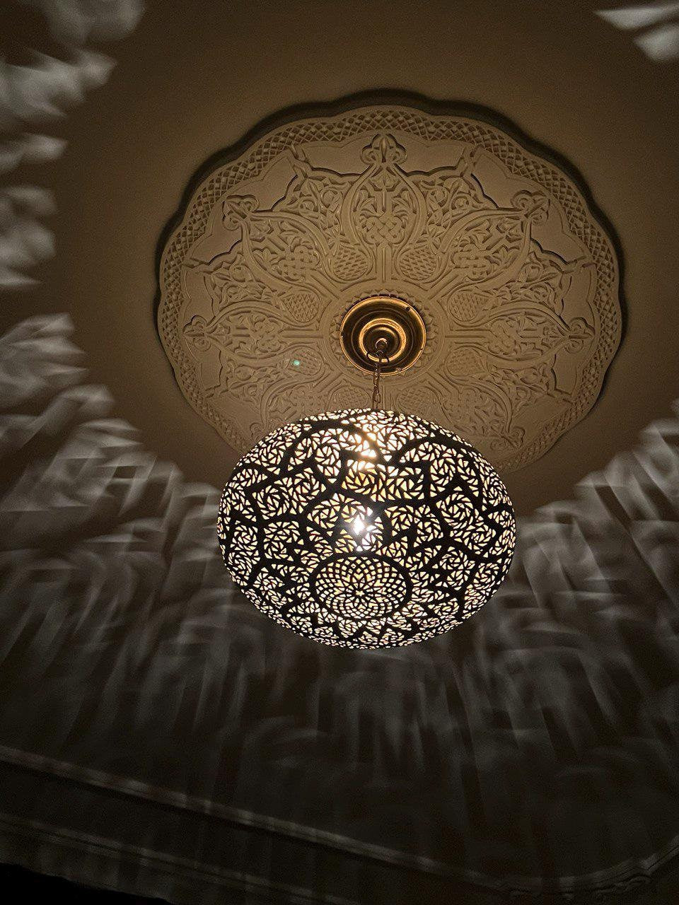 Minimalist brushed brass pendant light with warm finish for elegant home decor