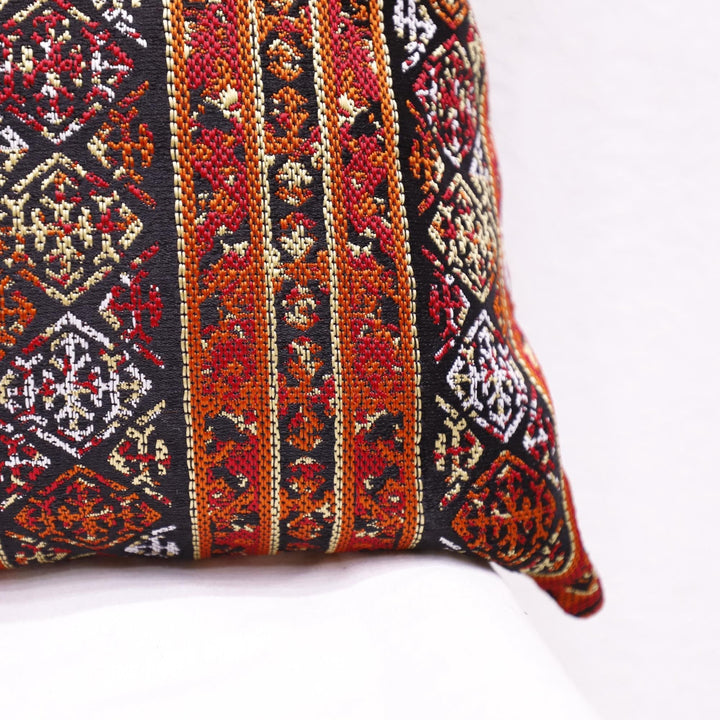 Bohemian tribal-style pillowcase displayed in a vintage-themed room.