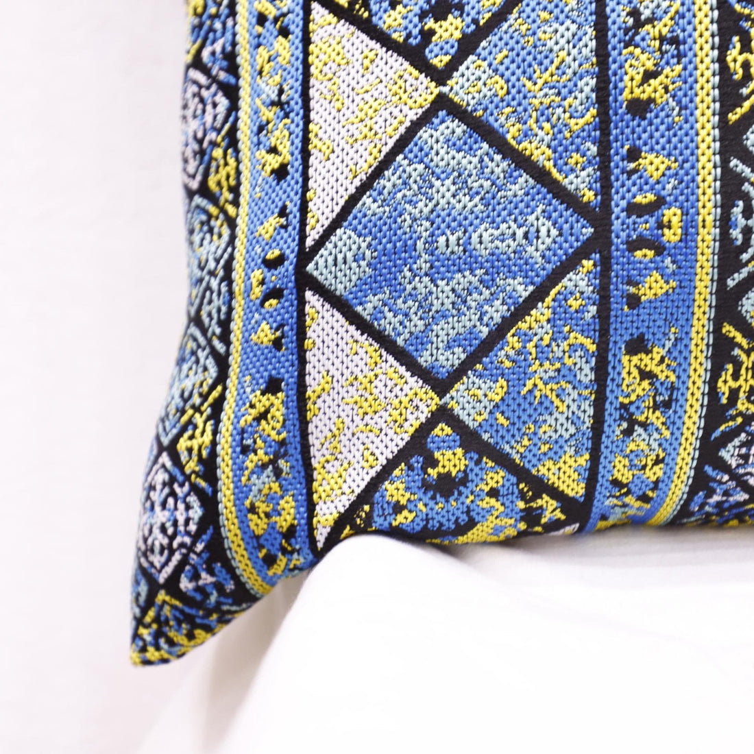 Eco-friendly boho pillow cover in a rustic living room.