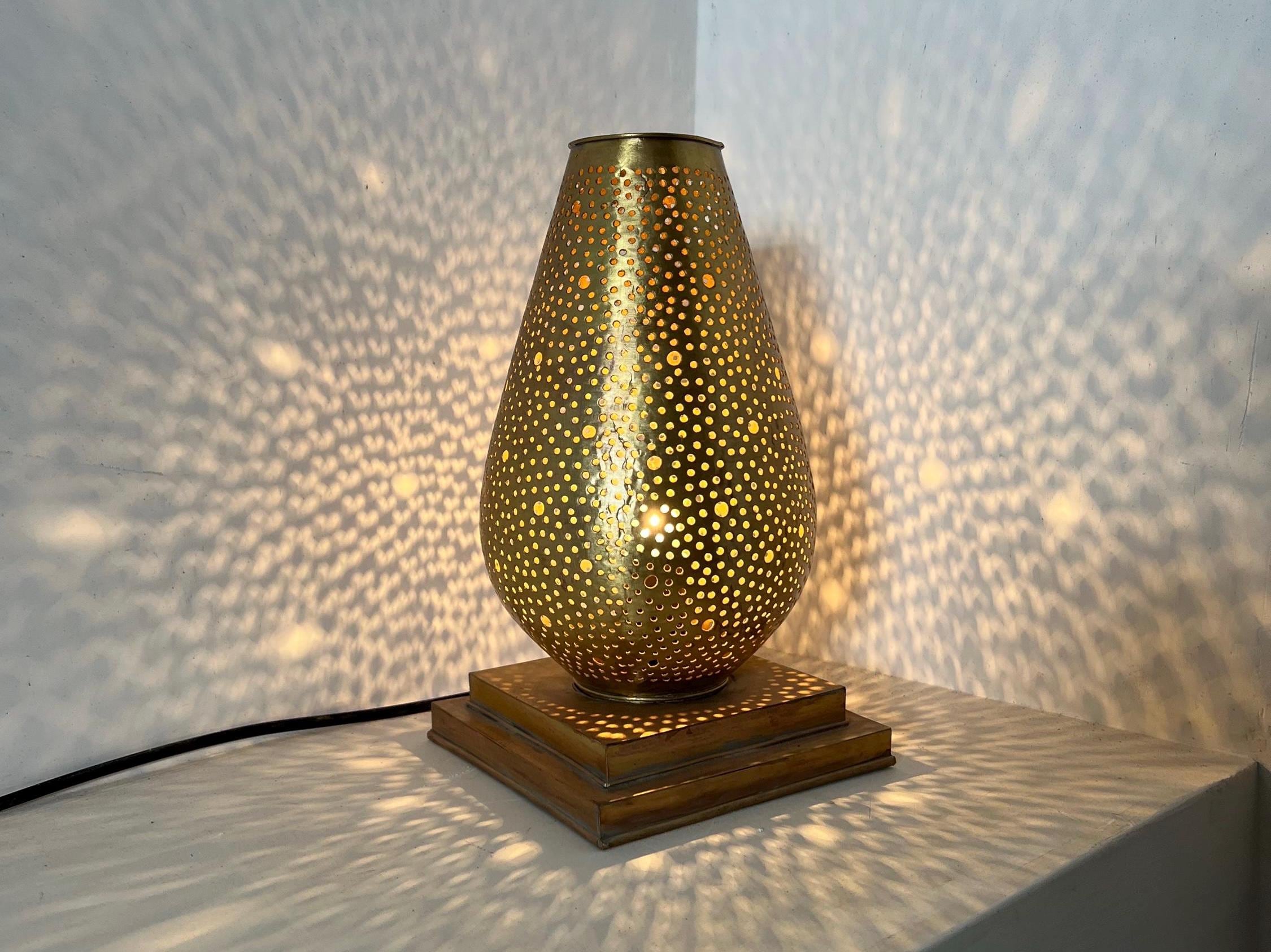 Handcrafted Moroccan brass floor lamp with perforated cutout design

